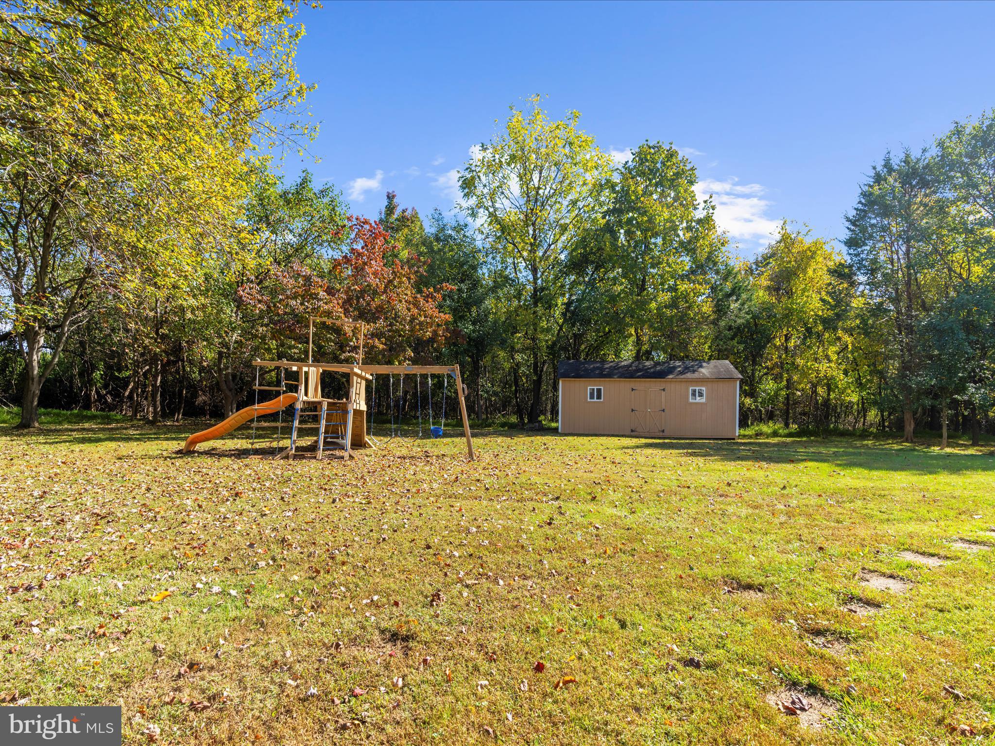 15533 Thompson Road Silver Spring, MD 20905 - Photo 56 of 76 a backyard of a house with yard and outdoor seating