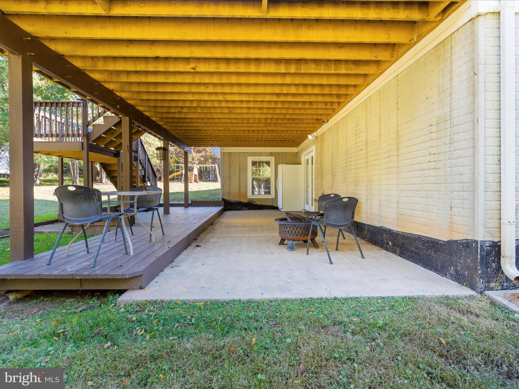 15533 Thompson Road Silver Spring, MD 20905 - Photo 60 of 76 a view of a patio with table and chairs and potted plants