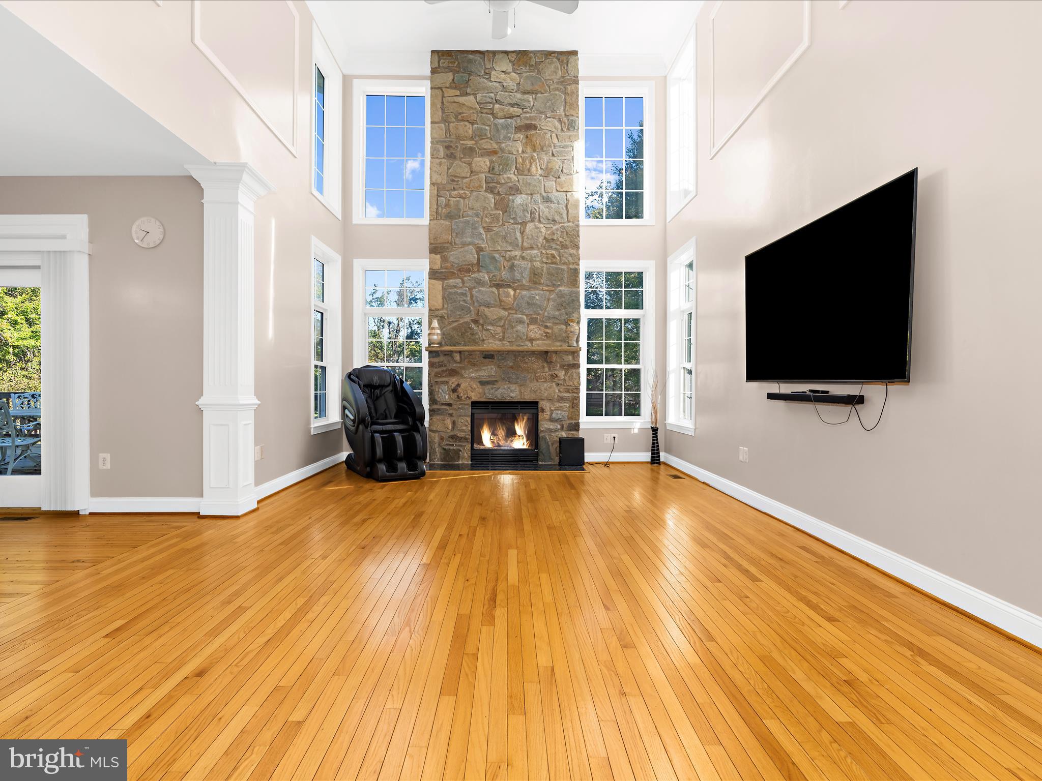 15533 Thompson Road Silver Spring, MD 20905 - Photo 6 of 76 a view of a livingroom with wooden floor and a flat screen tv