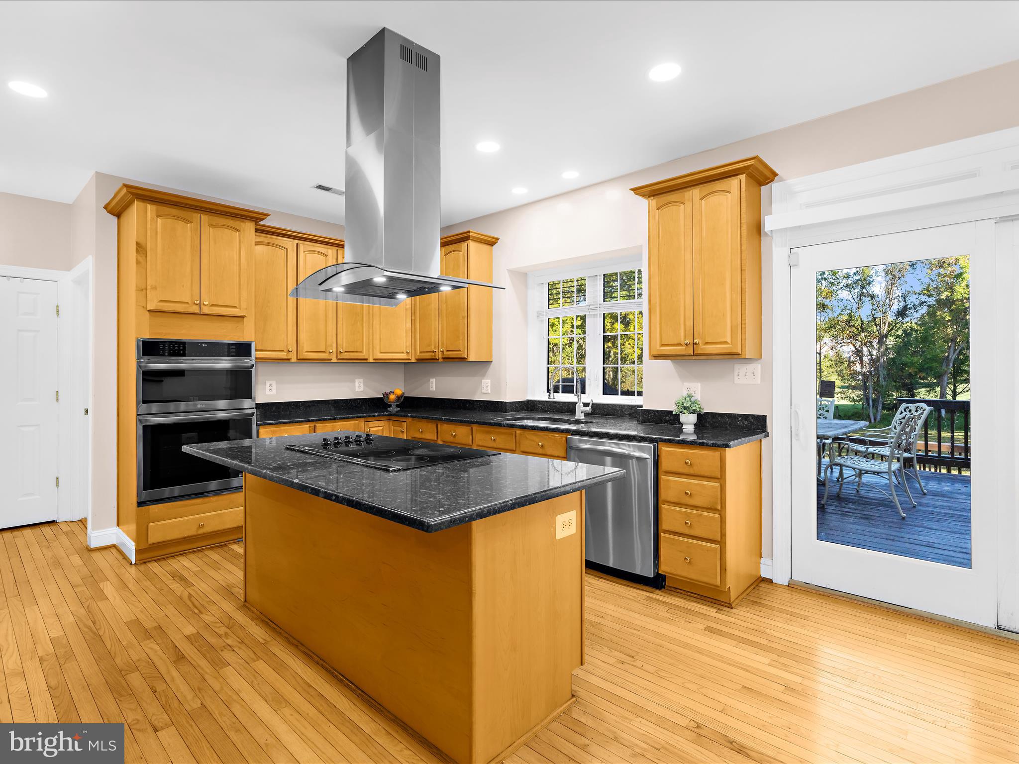 15533 Thompson Road Silver Spring, MD 20905 - Photo 10 of 76 a kitchen with stainless steel appliances granite countertop a stove a sink and a refrigerator