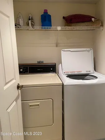 a kitchen with stainless steel appliances a sink stove top oven and cabinets