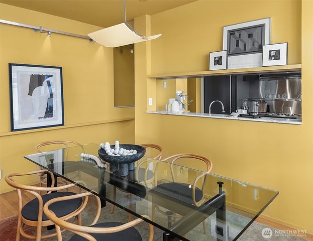 a dining room with furniture and window