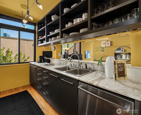 a kitchen with counter top space and stainless steel appliances