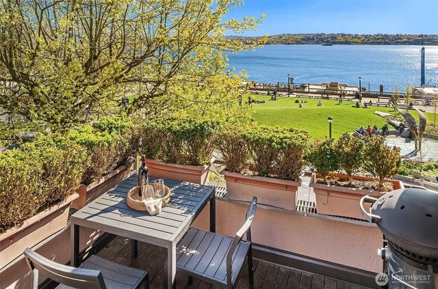 a view of a balcony with two chairs and a table
