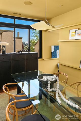 a kitchen with a sink and wooden floor