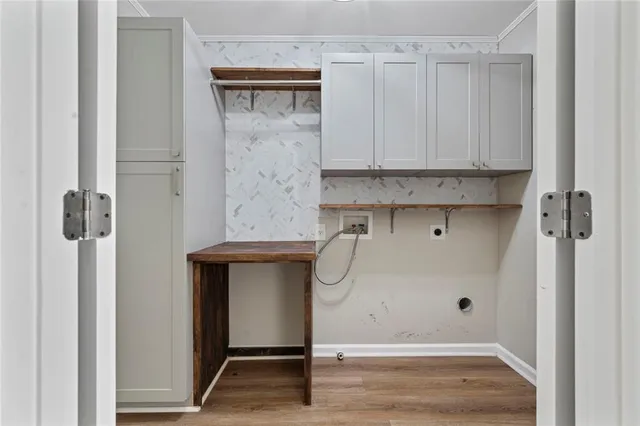 a bathroom with a granite countertop sink and white cabinets