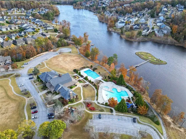an aerial view of a house with yard swimming pool and outdoor seating