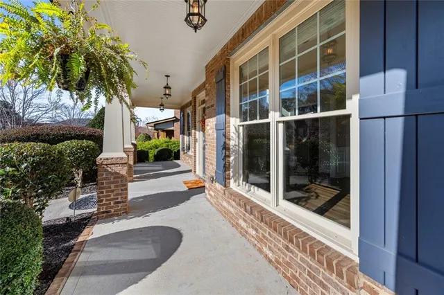 a view of a building with a potted plant and a window