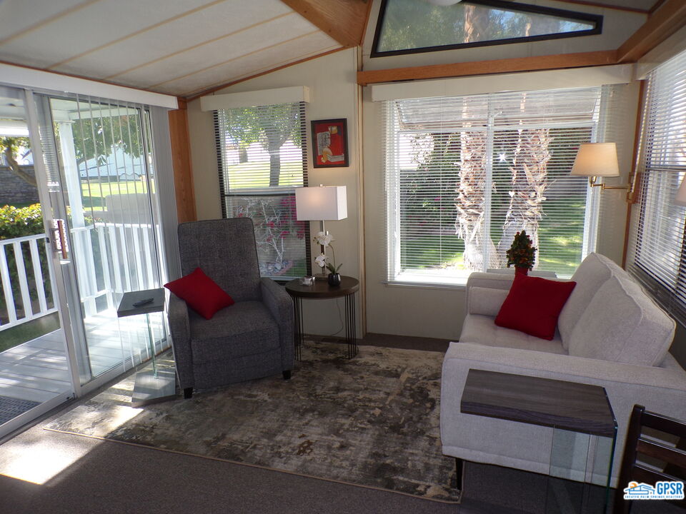 69801 Ramon Road, Unit 246 Cathedral City, CA 92234 - Photo 1 of 44 a living room with furniture and a window