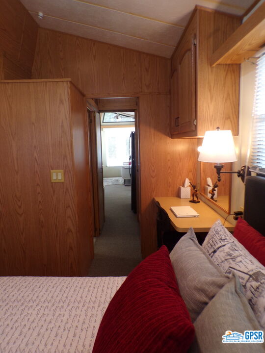 69801 Ramon Road, Unit 246 Cathedral City, CA 92234 - Photo 14 of 44 a bedroom with a bed and a closet