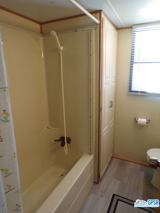 69801 Ramon Road, Unit 246 Cathedral City, CA 92234 - Photo 16 of 44 a bathroom with a shower and a toilet