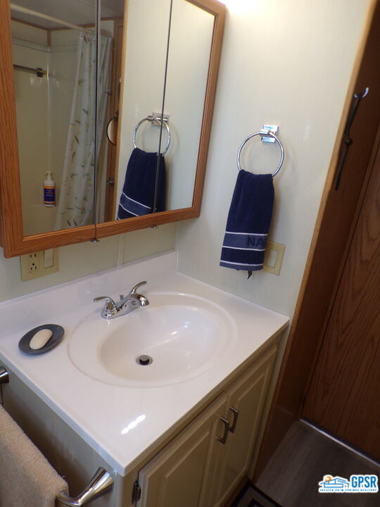 69801 Ramon Road, Unit 246 Cathedral City, CA 92234 - Photo 18 of 44 a bathroom with a sink and a mirror