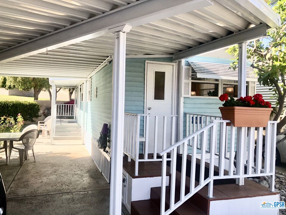 69801 Ramon Road, Unit 246 Cathedral City, CA 92234 - Photo 20 of 44 a view of a porch with wooden floor