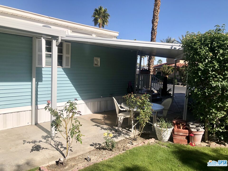 69801 Ramon Road, Unit 246 Cathedral City, CA 92234 - Photo 22 of 44 a view of a chairs and table in patio