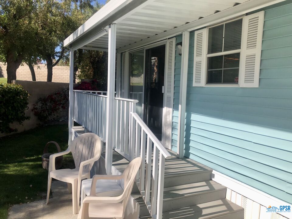 69801 Ramon Road, Unit 246 Cathedral City, CA 92234 - Photo 24 of 44 a view of a chair and tables in the balcony