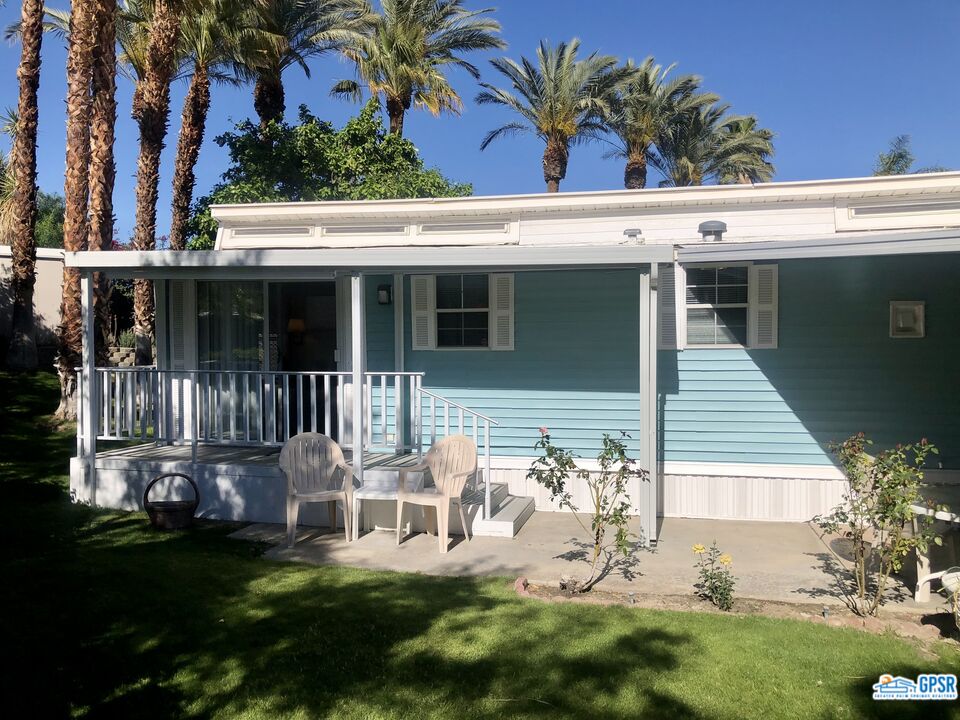 69801 Ramon Road, Unit 246 Cathedral City, CA 92234 - Photo 25 of 44 a view of a chair and table in backyard