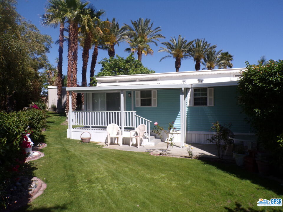 69801 Ramon Road, Unit 246 Cathedral City, CA 92234 - Photo 26 of 44 a house with garden in front of it