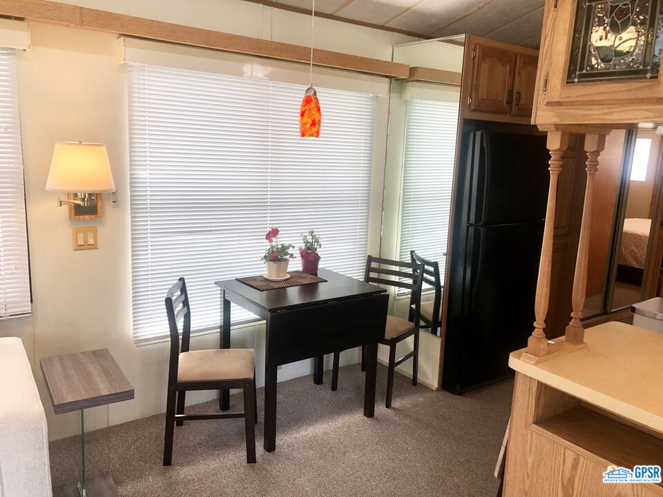 69801 Ramon Road, Unit 246 Cathedral City, CA 92234 - Photo 3 of 44 a view of a dining room with furniture