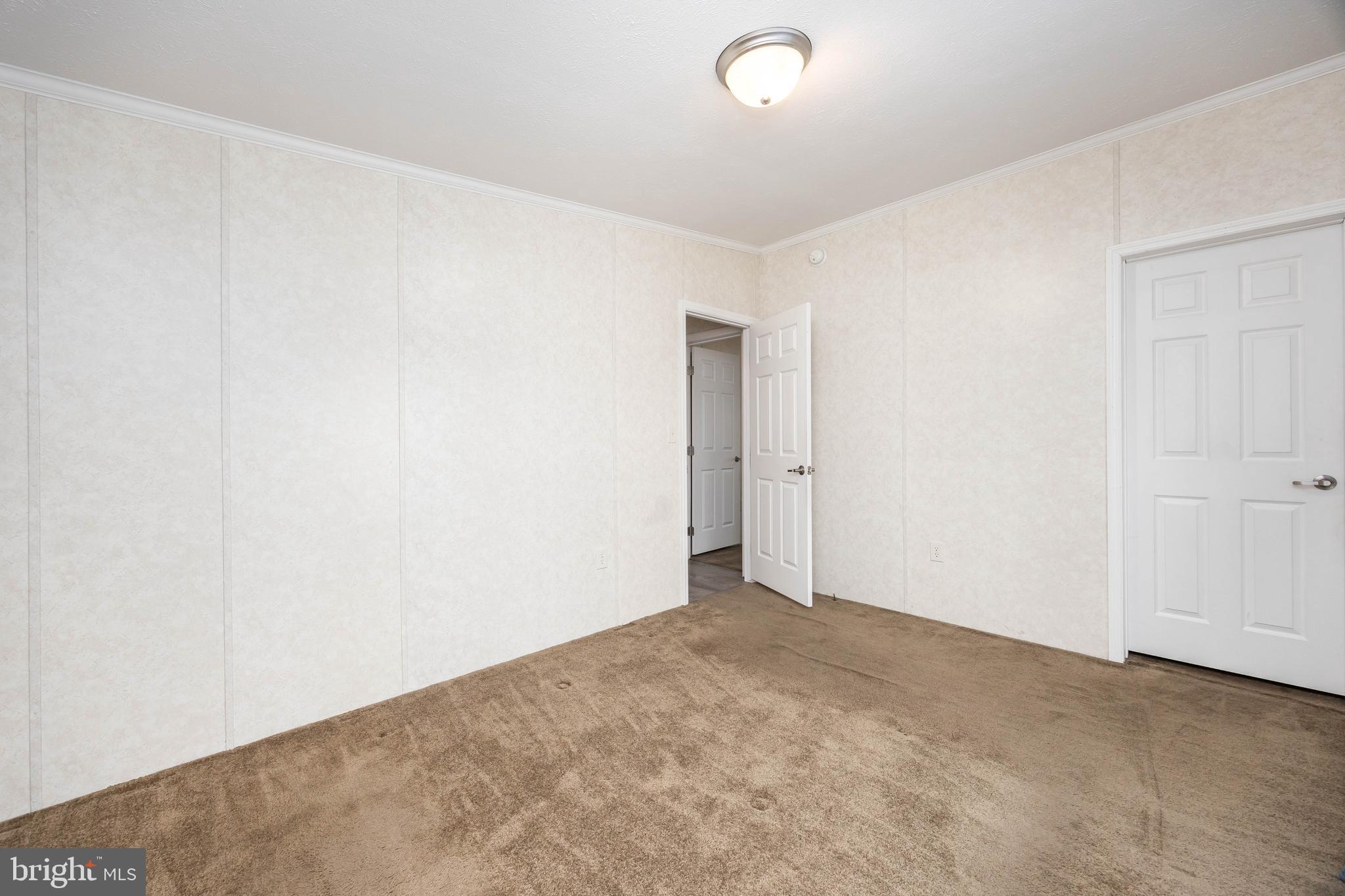 4258 Smith Road Salisbury, MD 21801 - Photo 40 of 43 an empty room with an entryway