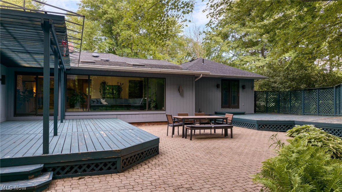 4830 Som Center Road Moreland Hills, OH 44022 - Photo 39 of 48 A paver patio extends the gathering space outdoors: the perfect spot for al fresco dining or evening cocktails, just steps from the deck and surrounded by the quiet beauty of the trees.