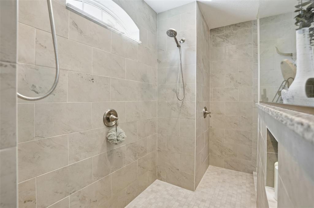 18166 Ramsey Road Weeki Wachee, FL 34614 - Photo 11 of 57 a bathroom with a shower