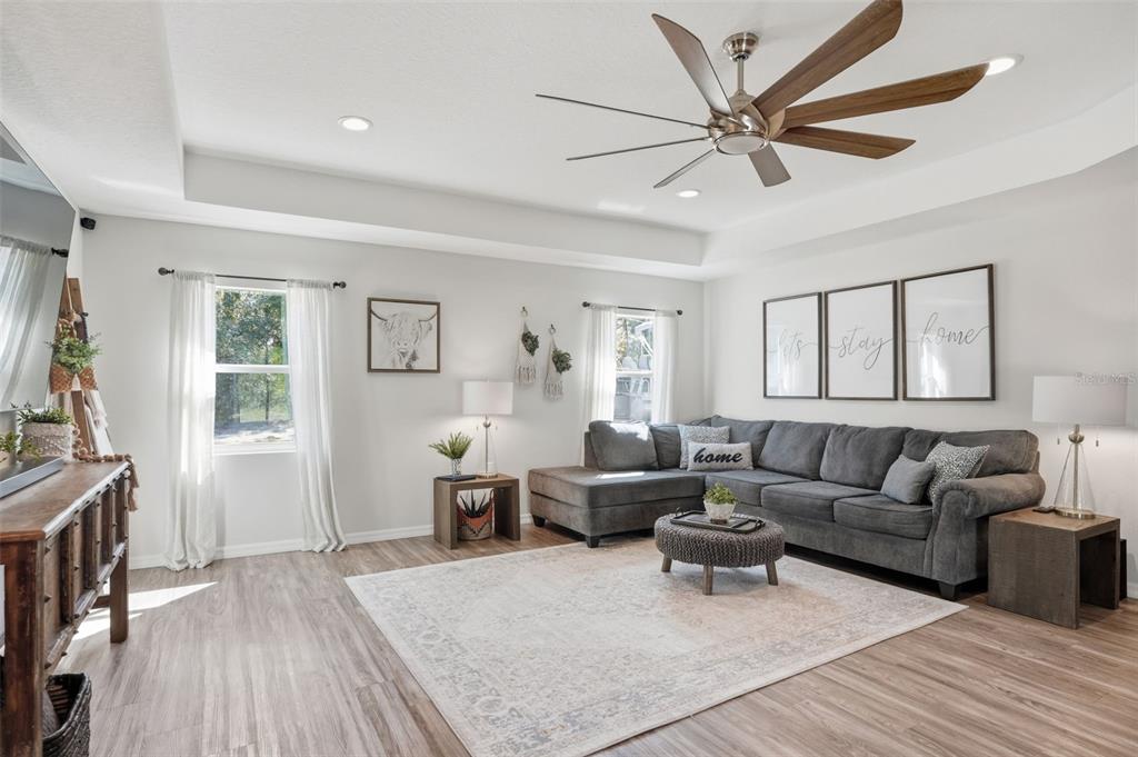18166 Ramsey Road Weeki Wachee, FL 34614 - Photo 18 of 57 a living room with furniture and a flat screen tv