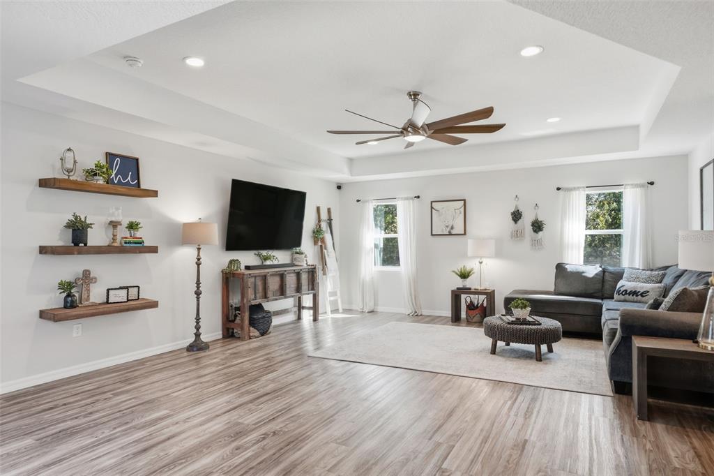 18166 Ramsey Road Weeki Wachee, FL 34614 - Photo 19 of 57 a living room with furniture and a flat screen tv