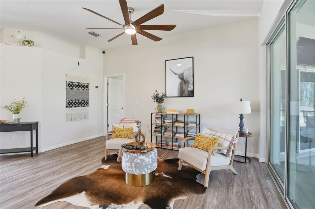 18166 Ramsey Road Weeki Wachee, FL 34614 - Photo 22 of 57 a living room with furniture and wooden floor