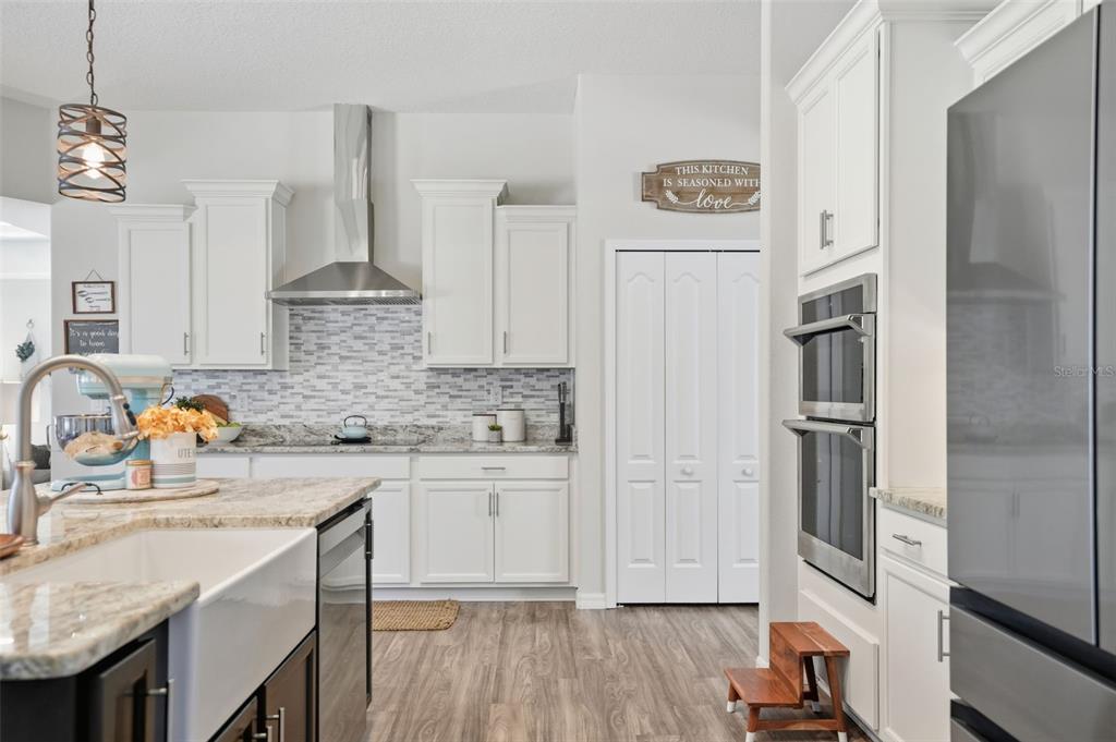 18166 Ramsey Road Weeki Wachee, FL 34614 - Photo 25 of 57 a kitchen with stainless steel appliances granite countertop a refrigerator and a sink