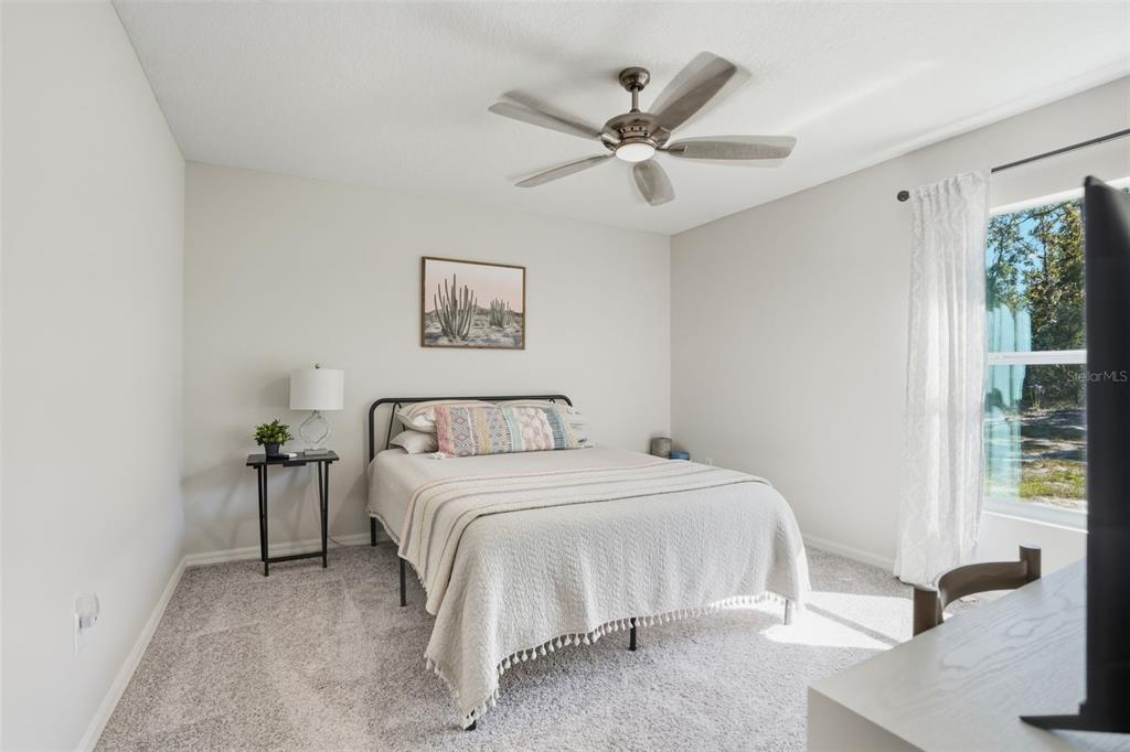 18166 Ramsey Road Weeki Wachee, FL 34614 - Photo 35 of 57 a bedroom with a bed and a painting on the wall