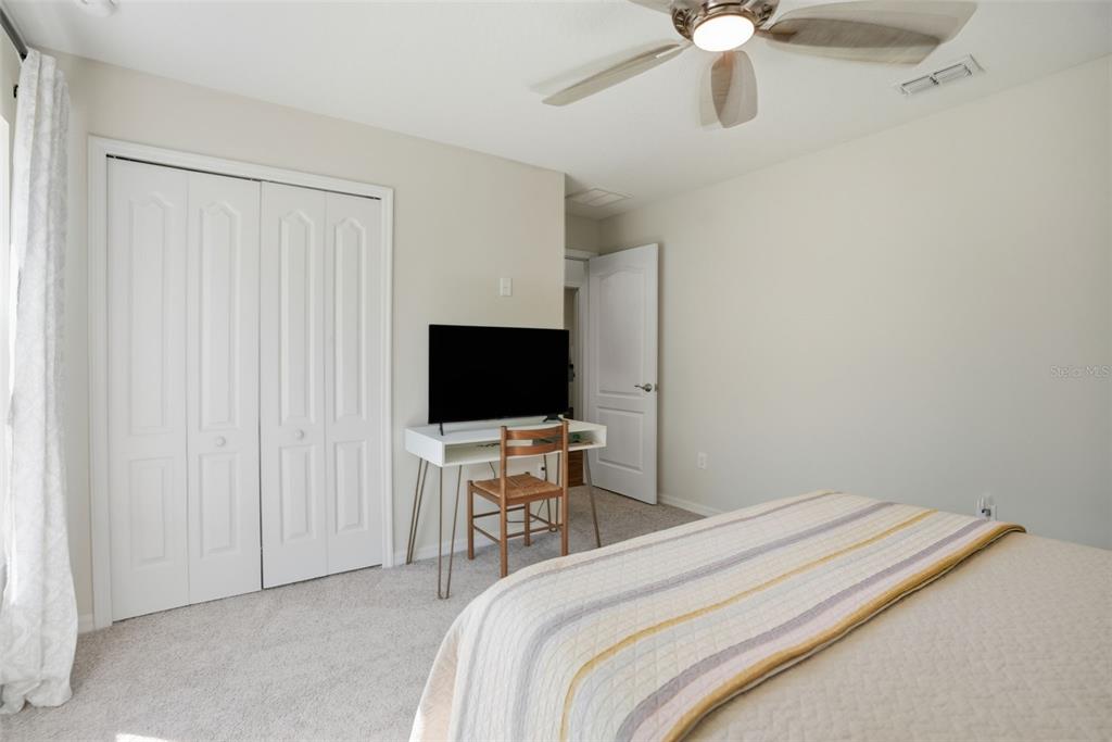 18166 Ramsey Road Weeki Wachee, FL 34614 - Photo 36 of 57 a bedroom with a bed and a flat screen tv
