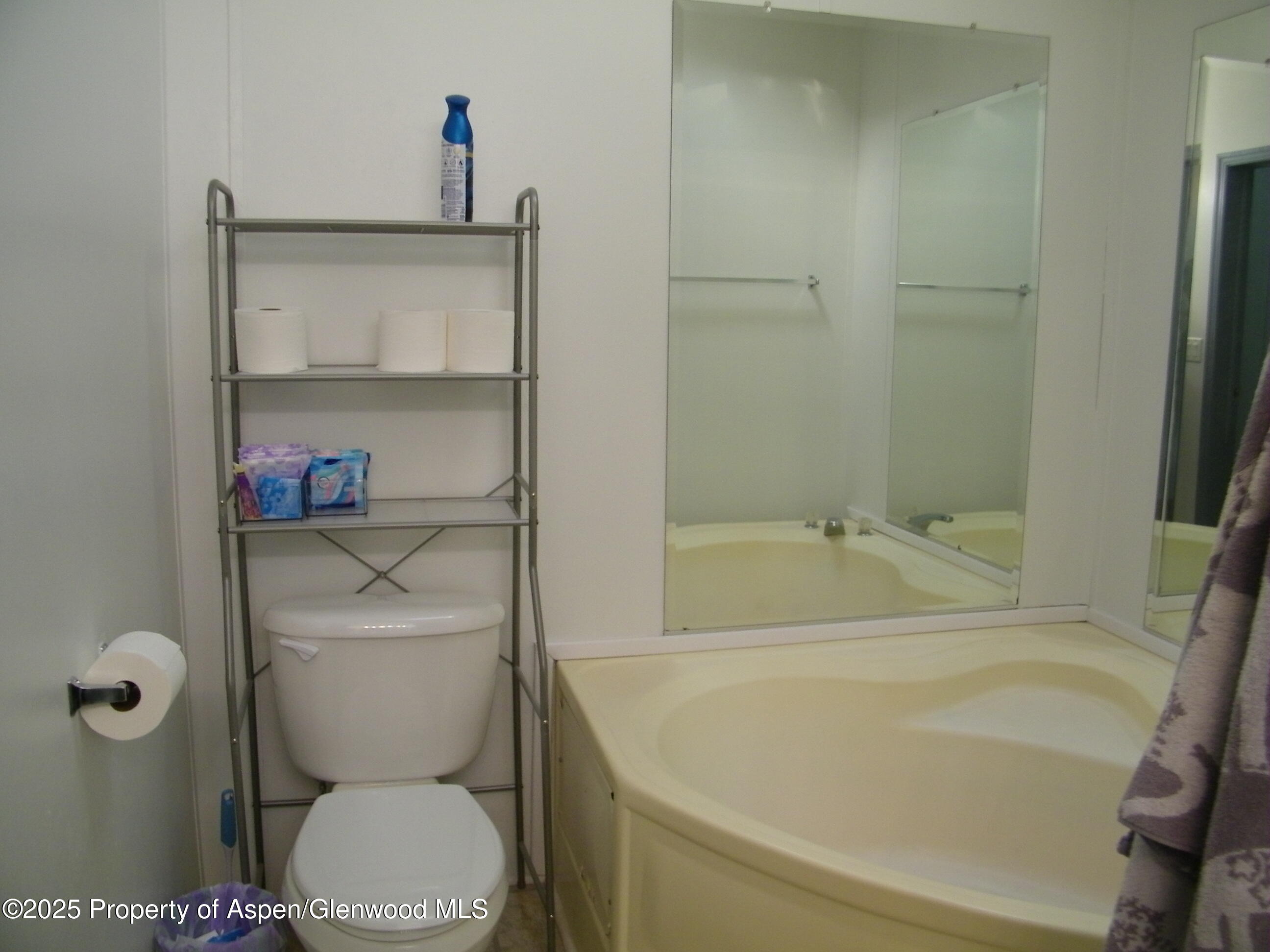 531 Park Avenue Rifle, CO 81650 - Photo 14 of 27 a bathroom with a toilet and a shower