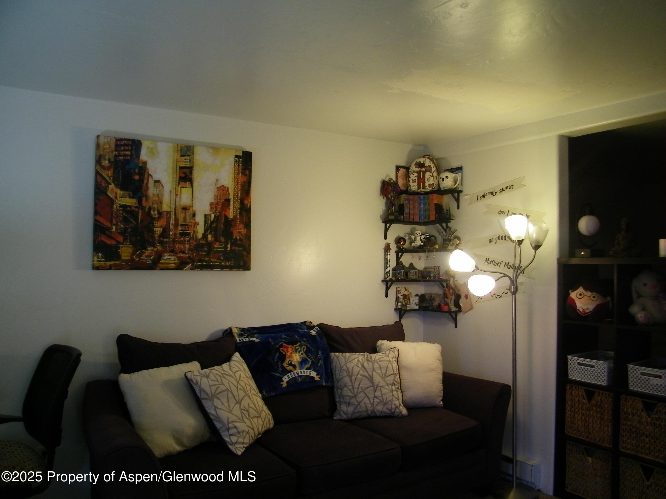 531 Park Avenue Rifle, CO 81650 - Photo 22 of 27 a living room with furniture and wooden floor