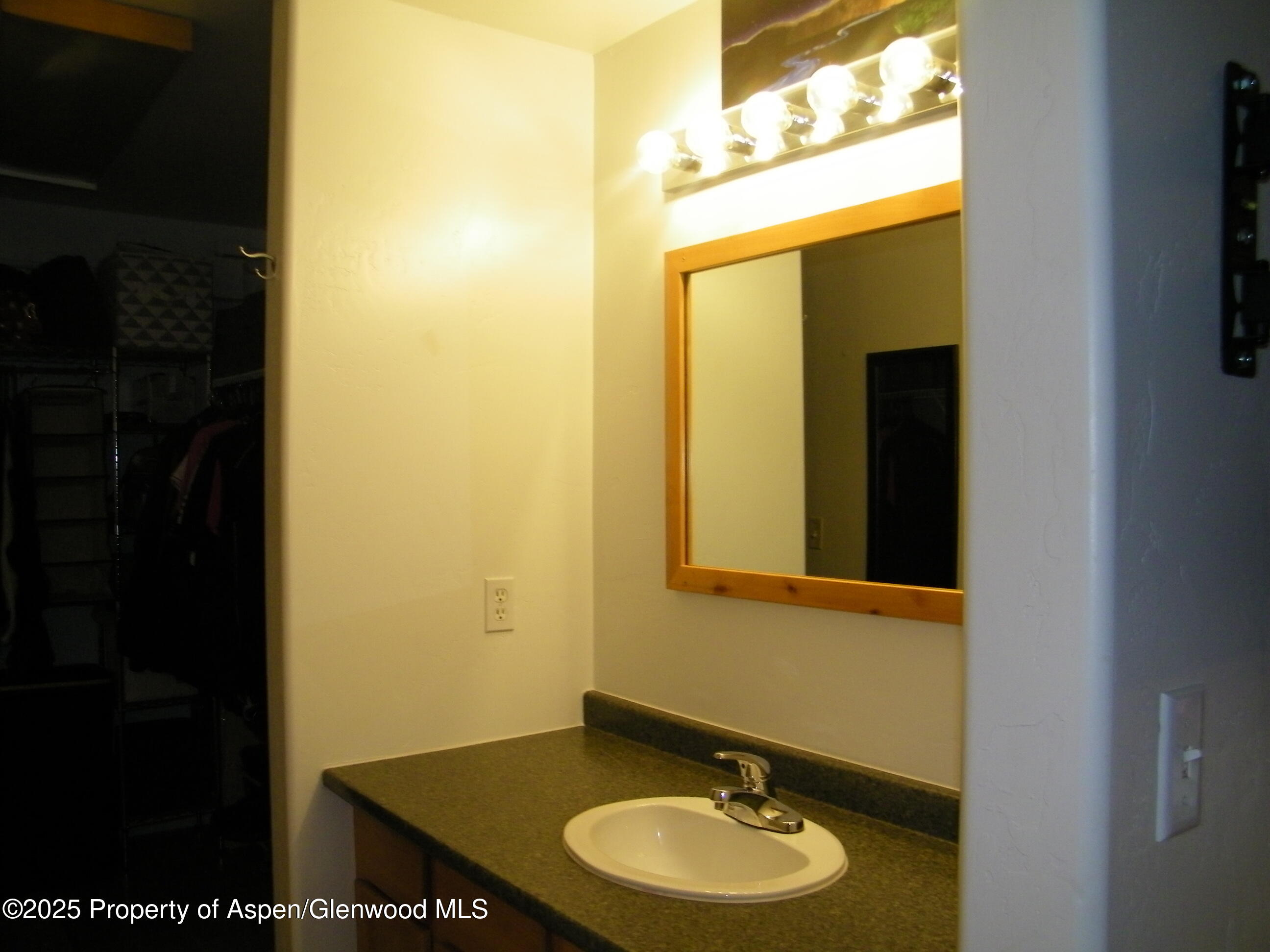 531 Park Avenue Rifle, CO 81650 - Photo 26 of 27 a bathroom with a sink and a mirror