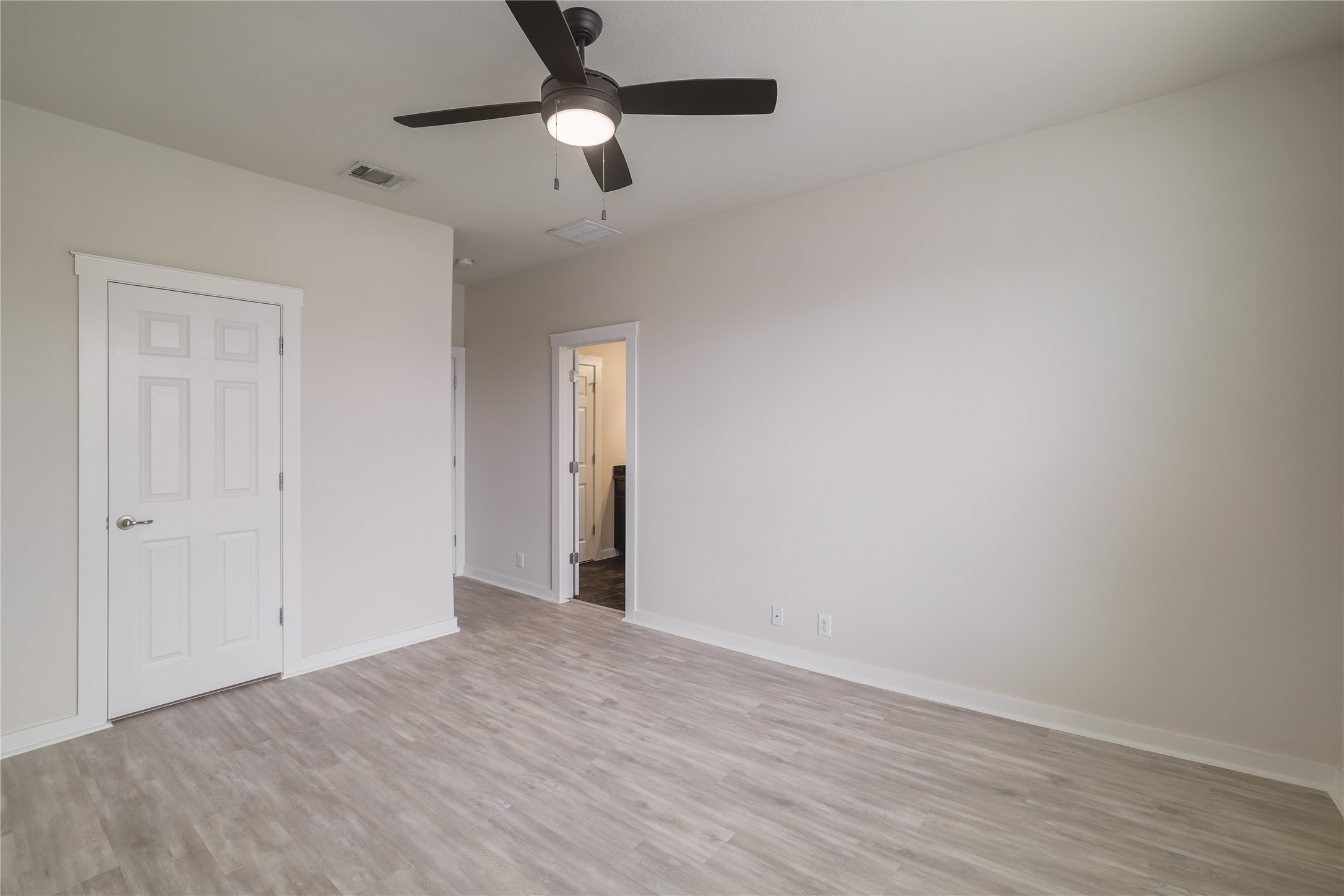2101 Rivers Edge Way, Unit 26 Austin, TX 78741 - Photo 17 of 29 Primary bedroom.
