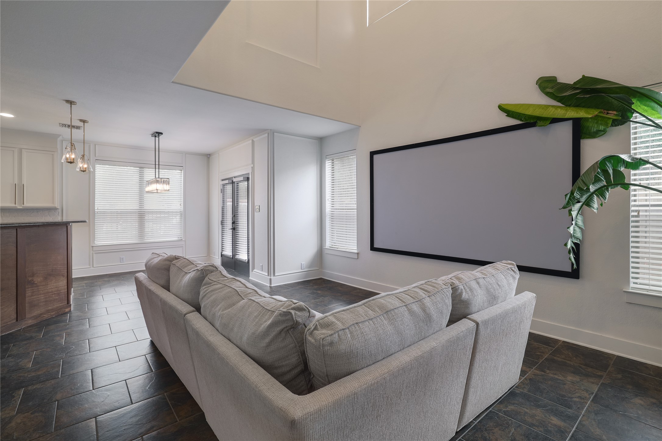 2101 Rivers Edge Way, Unit 26 Austin, TX 78741 - Photo 7 of 29 Living room with projector & screen.