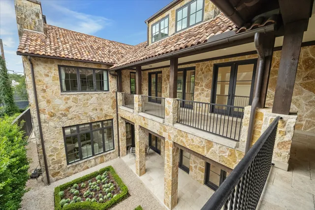 a view of a house with a small deck
