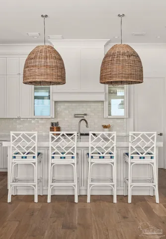 a kitchen with granite countertop a stove and a sink