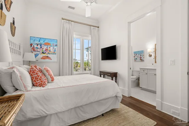 a bedroom with a bed and a mirror