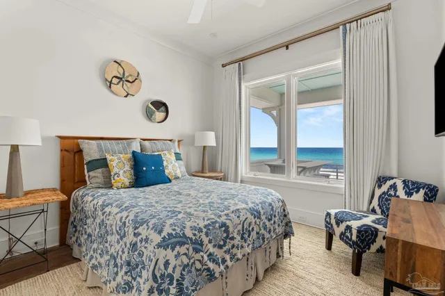a view of roof deck with ocean view and wooden floor