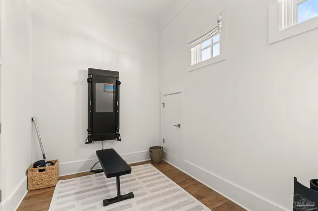 a view of a room with wooden floor and stairs
