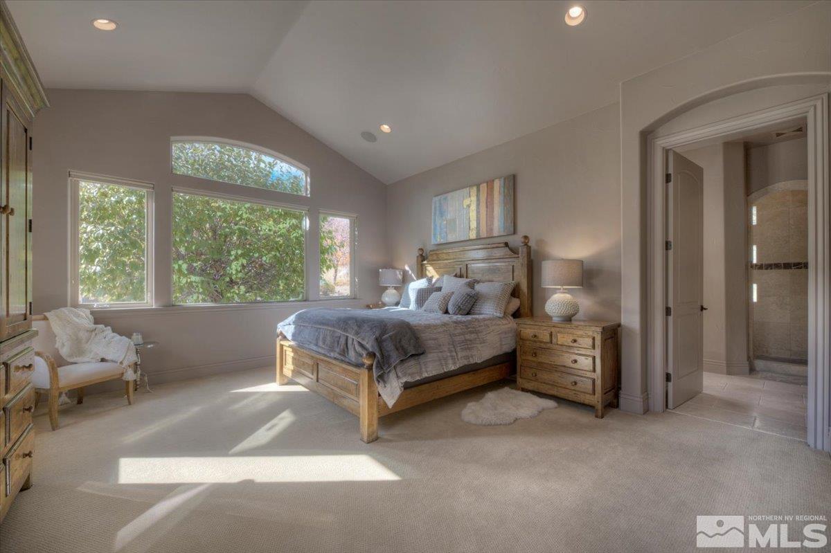 1318 Wolf Run Road Reno, NV 89511 - Photo 13 of 37 a bedroom with a bed and large window