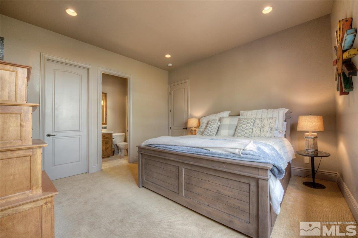 1318 Wolf Run Road Reno, NV 89511 - Photo 20 of 37 a bedroom with a bed and a lamp