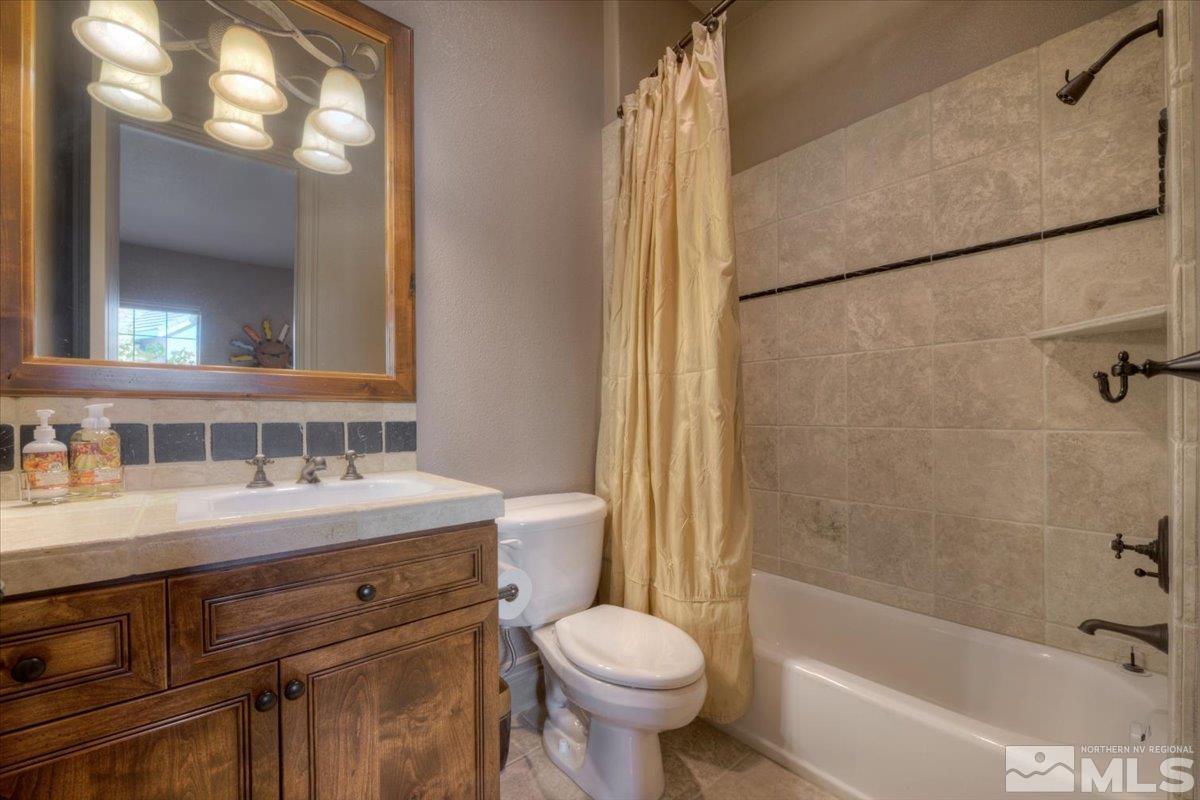 1318 Wolf Run Road Reno, NV 89511 - Photo 21 of 37 a bathroom with a sink toilet and shower