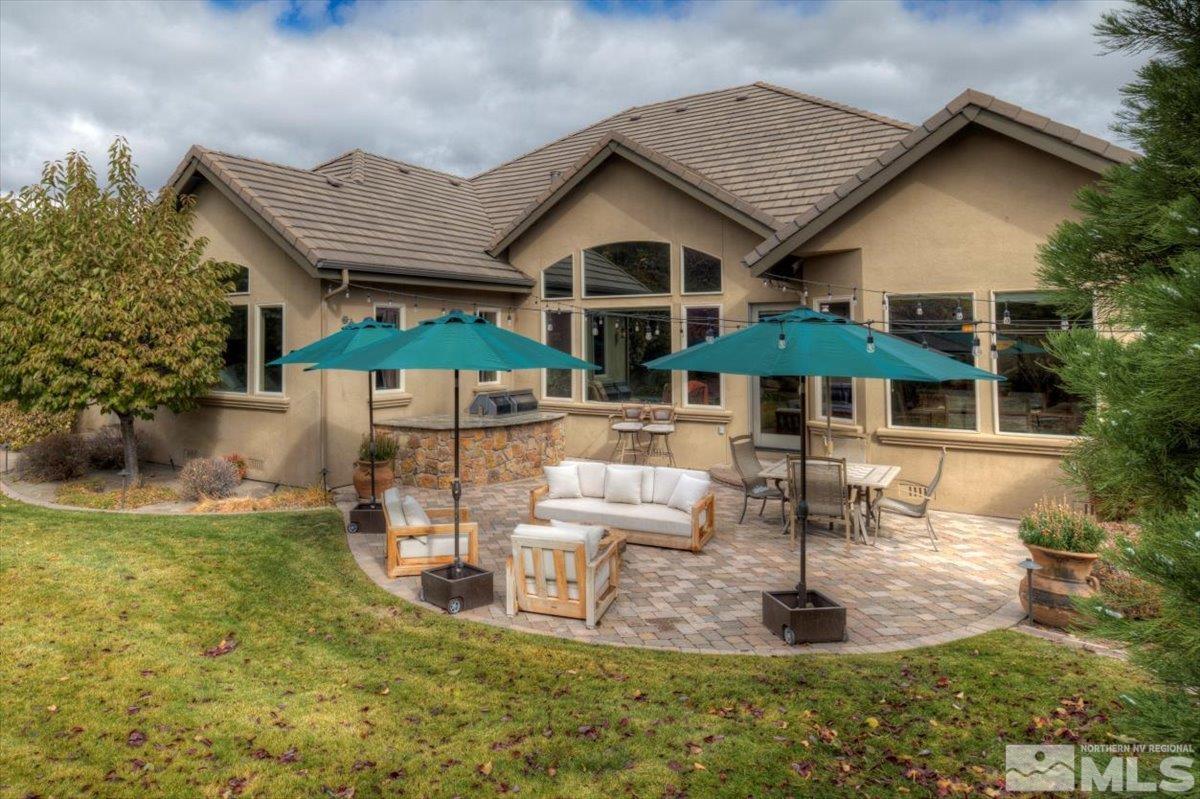 1318 Wolf Run Road Reno, NV 89511 - Photo 28 of 37 a patio with table and chairs