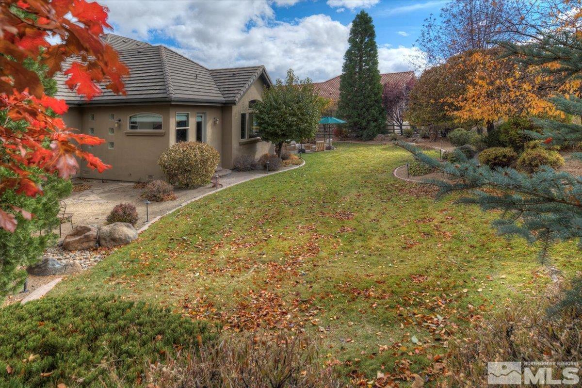 1318 Wolf Run Road Reno, NV 89511 - Photo 31 of 37 a backyard of a house with a garden and plants