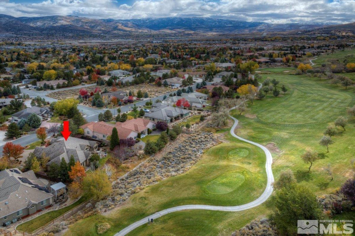 1318 Wolf Run Road Reno, NV 89511 - Photo 34 of 37 an aerial view of residential houses with outdoor space and trees