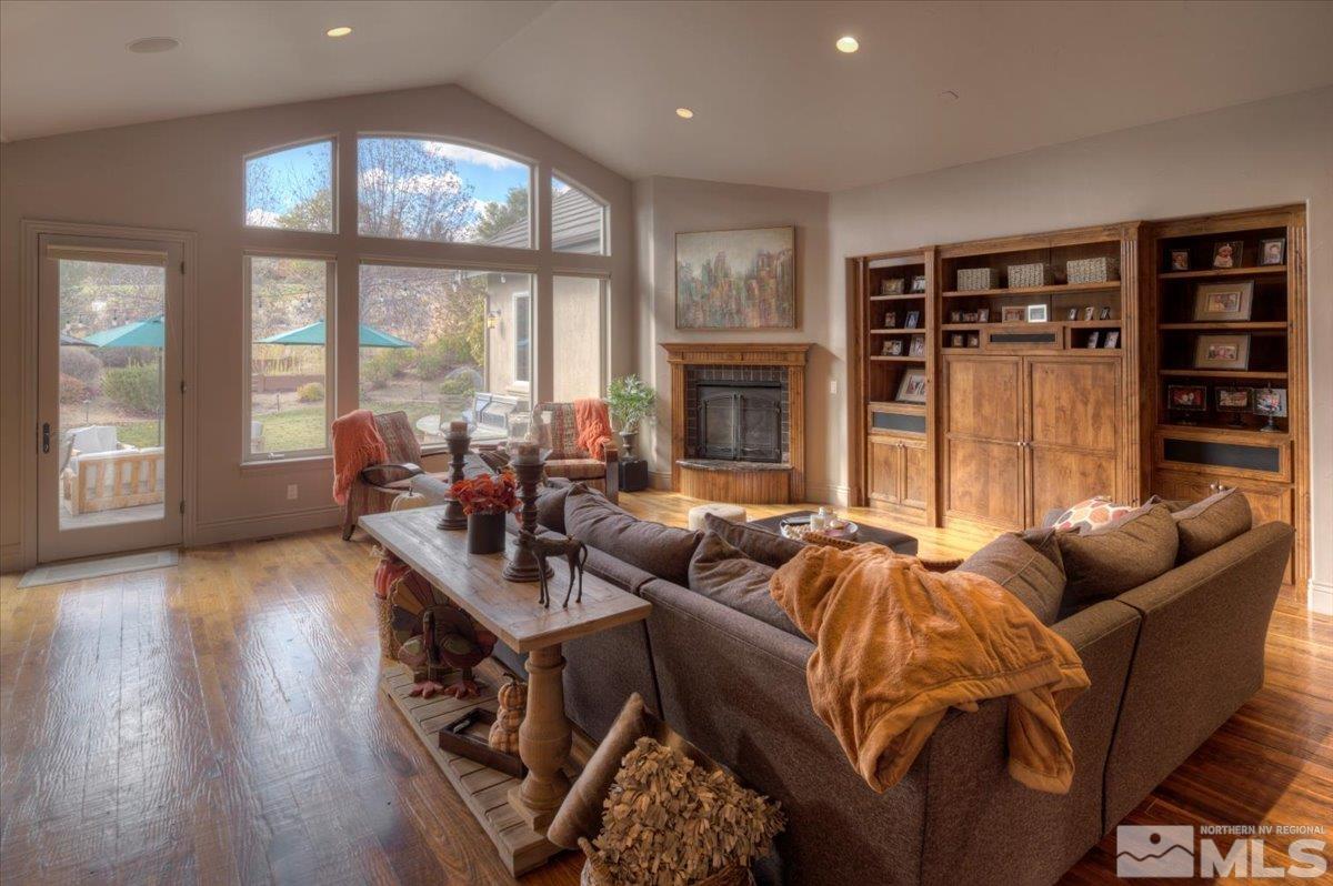 1318 Wolf Run Road Reno, NV 89511 - Photo 5 of 37 a living room with furniture and a fireplace