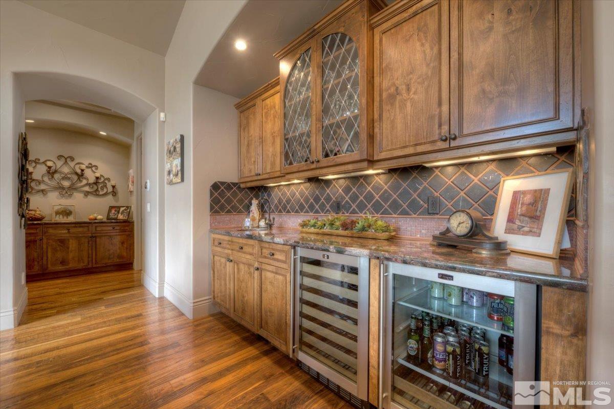 1318 Wolf Run Road Reno, NV 89511 - Photo 7 of 37 a kitchen with stainless steel appliances granite countertop a stove and a sink