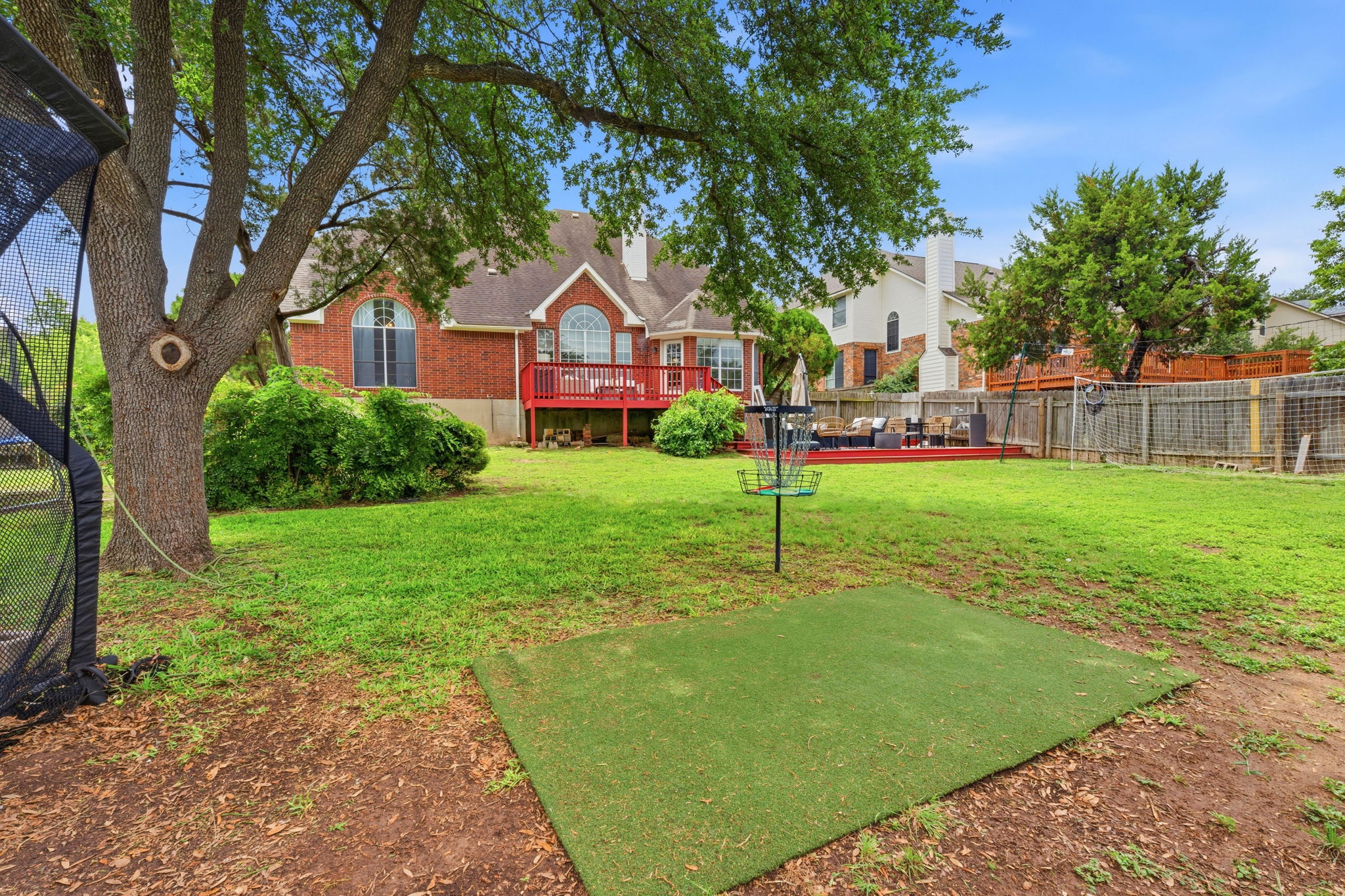 8317 Pommel Drive Austin, TX 78759 - Photo 26 of 26 A spacious yard with mature trees offers a private retreat for outdoor enjoyment.